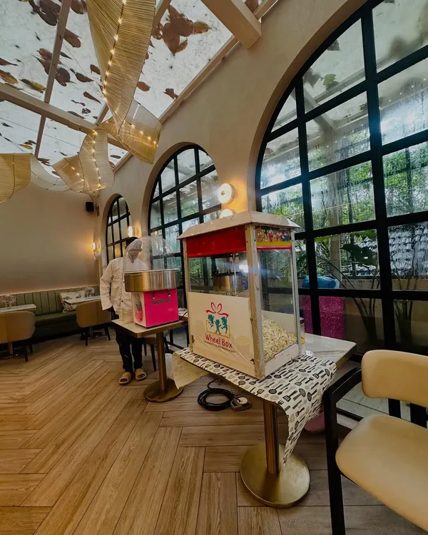 Our popcorn and cotton candy stations set up side-by-side in a beautiful, airy venue. We handle the entire setup and service, so you can relax and enjoy.