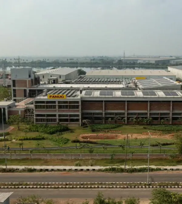 This is the award-winning factory we designed for Fanuc India in Chennai, which showcases our approach to sustainable industrial architecture. The building incorporates natural materials like exposed brick and is designed to harmonize with its surrounding landscape, challenging the traditional look and feel of a factory.