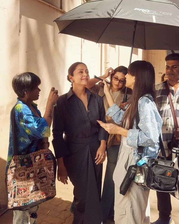 A candid moment on set with Jyotika and the team. An umbrella for shade, a quick touch-up, and we are ready for the next shot.