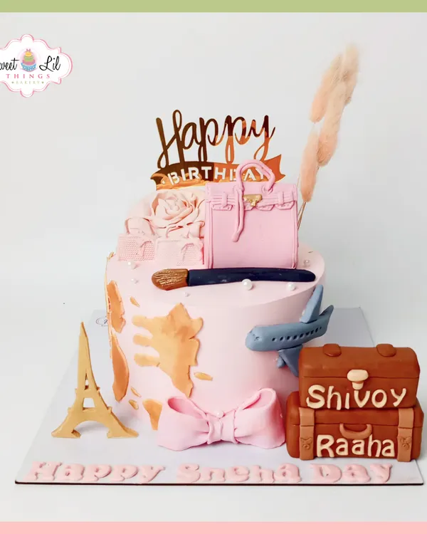 This cake is a dream for anyone who loves travel and fashion. It features a world map texture, an edible designer handbag, a makeup brush, and iconic travel symbols like the Eiffel Tower and mini suitcases.