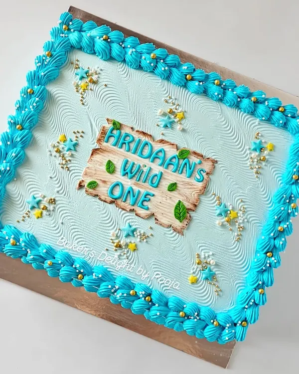 Planning a large party? A sheet cake is a game-changer. This "Wild One" themed sheet cake was designed to accompany a main birthday cake, making it easy to serve all the guests without stress.