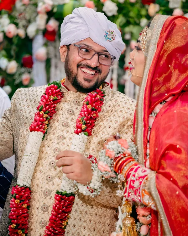 A candid moment of joy between the bride and groom during their Nikah ceremony. Capturing these genuine smiles is what makes a wedding album feel alive.
