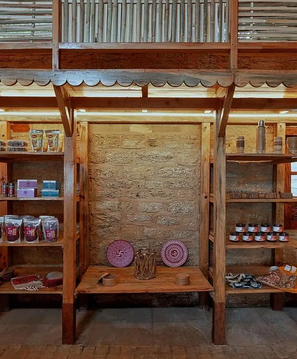The Sargakhet Handicraft Centre is an adaptive reuse project where we transformed a British-era post office in Mukteshwar. The interior now features versatile wooden columns that double as display racks, showcasing local artisan products against the beautifully restored original stone walls.