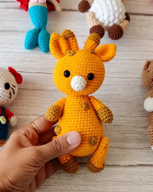 This little crochet giraffe is one of my favorite animal creations. It's soft, cuddly, and makes a wonderful gift for a newborn or toddler.