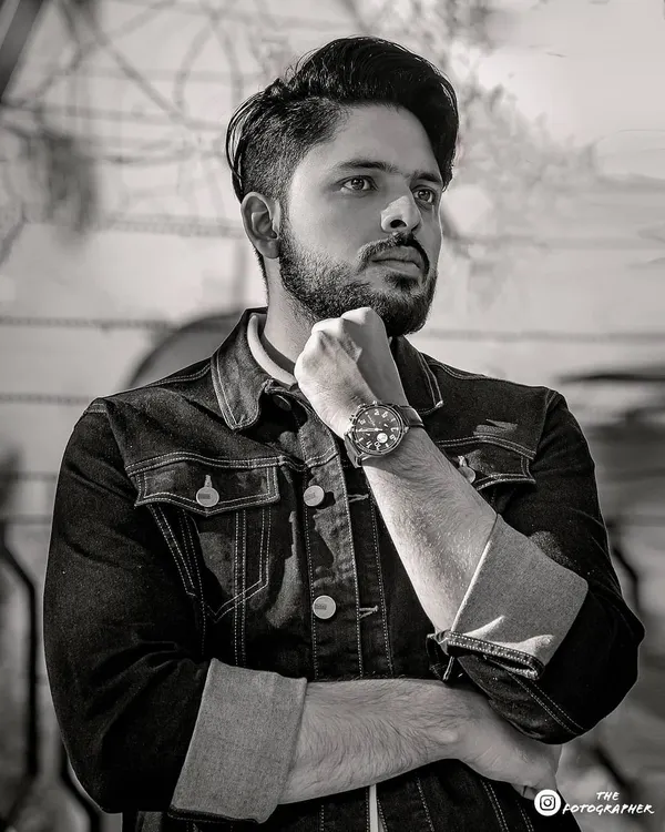 A classic black and white portrait for a men's lookbook. The strong pose and crisp monochrome edit create a timeless and stylish feel.