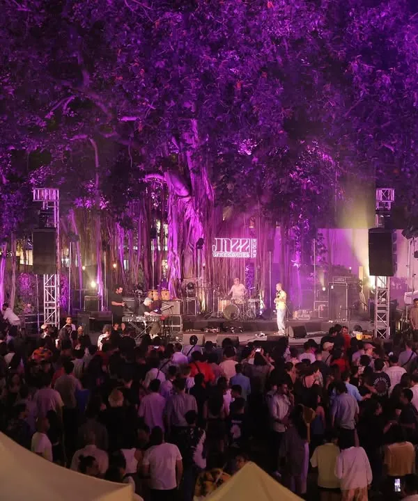 This is what it's all about. The Jazz Weekender main stage, set under a massive banyan tree, with the entire space lit up and a crowd fully immersed in the music. We build these large scale festival experiences from the ground up to create a real community vibe.