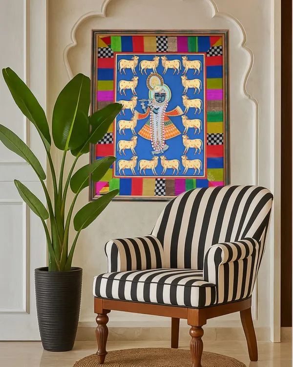 A Pichwai painting I framed for a client, seen here in its new home in Singapore. The custom border, made from colorful fabric scraps, was designed to complement the artwork and create a unique, personal piece of decor.