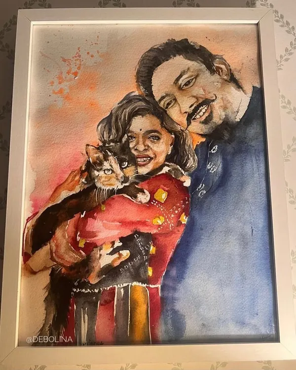This commissioned watercolor portrait captures a beautiful family moment with a couple and their cat. It's a joy to paint these connections, creating a piece that will be a treasured part of their home.