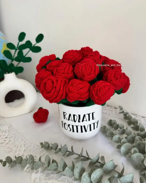 A beautiful bouquet of handmade crochet red roses. These flowers will never fade, making them a perfect symbol of everlasting love.