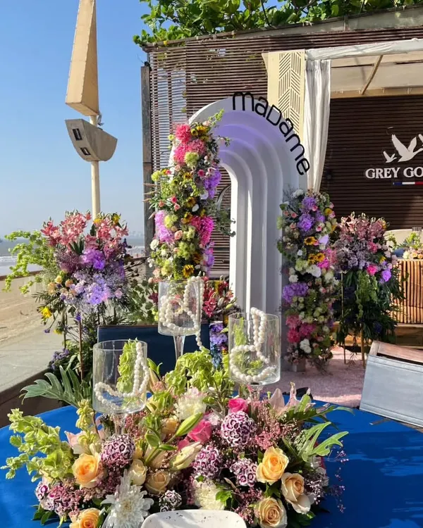 We brought a touch of spring to the Mumbai seaside for the launch of Madame's new collection. This beautiful tablescape, set against the ocean, features a custom floral centerpiece and a branded archway, creating a perfect backdrop for an elegant brand event with Shanaya Kapoor.