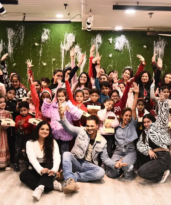 Our entire dance family, kids and adults, gathered for a group photo at our Christmas party. It was an evening full of joy, games, and festive cheer.