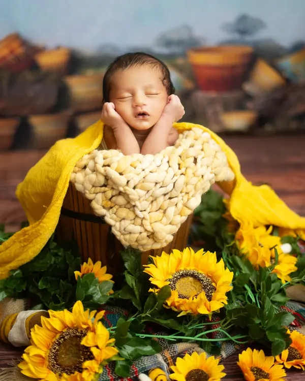 This is the magic I love to create. A sleeping newborn, nestled amongst sunflowers, dreaming sweet dreams in my cozy studio. We use beautiful, safe props to bring your vision to life, creating a piece of art that you will treasure forever.