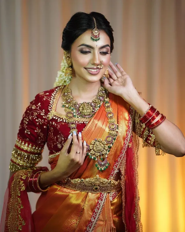 A closer look at this evergreen bridal outfit. The detailed work on the velvet blouse and the way the silk saree drapes is what makes this look so special for a bride's big day.