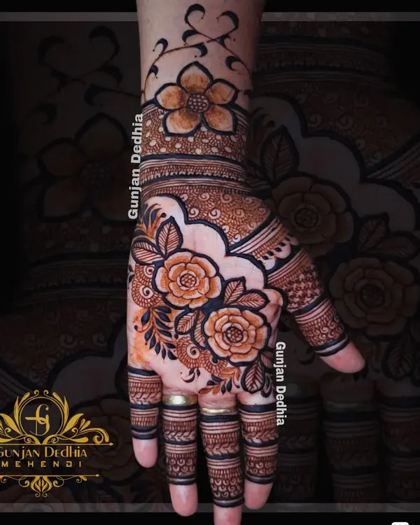 A gorgeous floral design that flows from the wrist to the fingers. The combination of bold roses and delicate leafy vines creates a beautiful and elegant look.