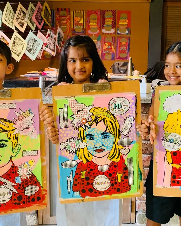 We believe in celebrating every masterpiece. Here, our young artists proudly display their finished Pop Art portraits, inspired by the bold style of Roy Lichtenstein. It is a joy to see them explore color, pattern, and self-expression with such confidence.