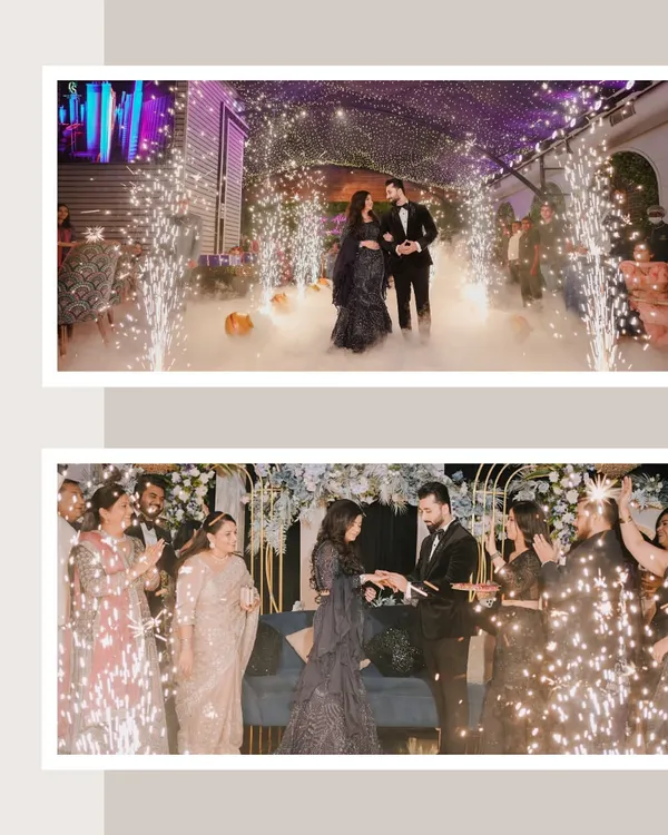 A spectacular engagement party entrance. The couple is framed by sparklers and smoke, creating a magical and celebratory atmosphere as they walk in.