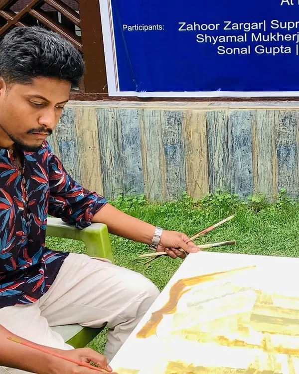 Working on an acrylic painting during a National Art Workshop in Pahalgam, Kashmir. This piece depicts the historical destruction of the Martand Sun Temple, exploring themes of cultural loss and resilience.