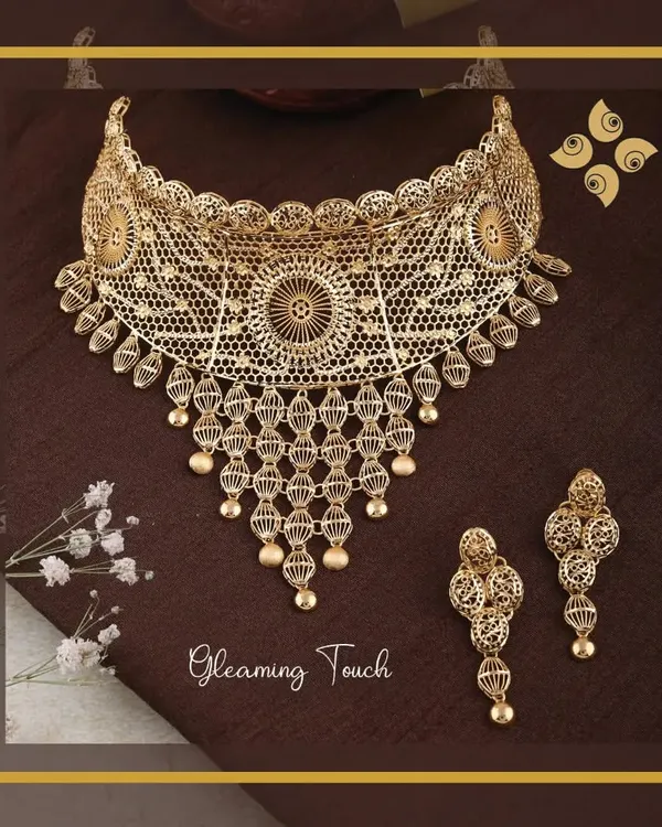 An exquisite example of our filigree work, this gleaming gold choker and earring set is incredibly detailed yet lightweight, showcasing superior craftsmanship.