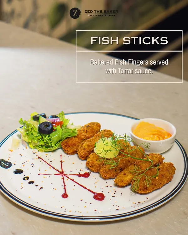 To start your meal, I recommend my golden-battered Fish Sticks. They are perfectly crispy on the outside and tender inside, served with a classic, creamy tartar sauce for dipping.