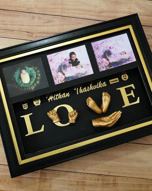 The 'LOVE' sculpture is a wonderful way to capture the connection between siblings. This frame for Hithan and Thashvika combines their hand and foot casts with photos, creating a piece full of warmth and affection.