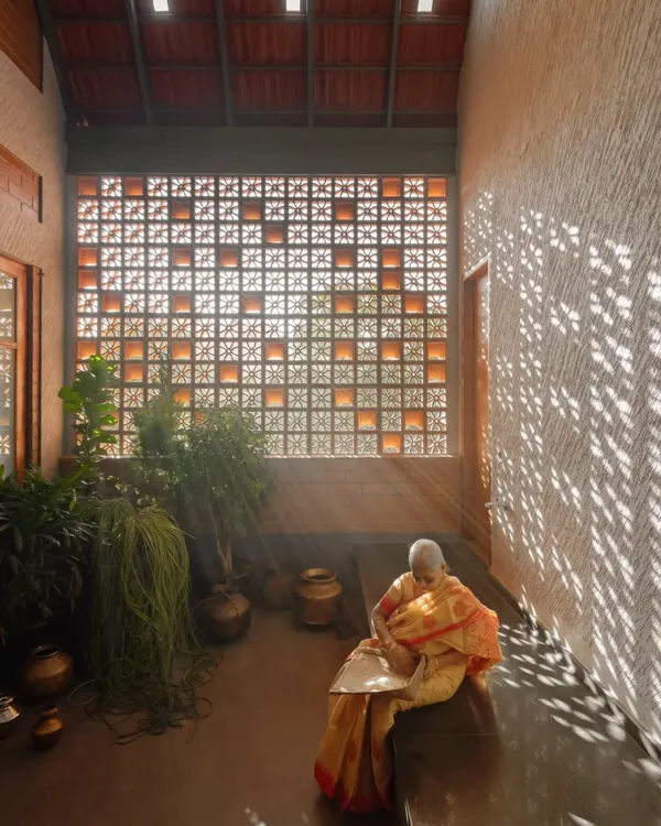 This space captures the essence of my design approach. Here, a re-interpreted courtyard uses a terracotta jali screen to filter the sun, creating shifting patterns of light and shadow that bring the room to life throughout the day.