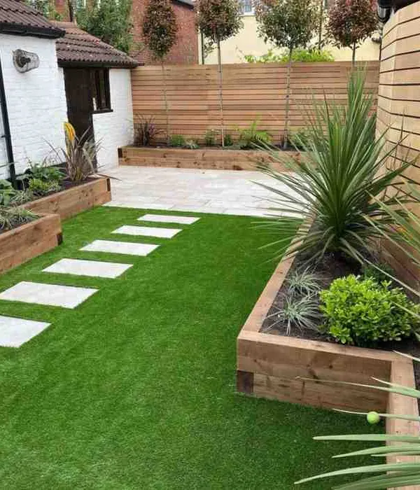 This modern backyard is a great example of a complete garden transformation. I combined lush artificial grass with clean stone pavers and raised wooden planters to create a stylish, low-maintenance outdoor living space that looks perfect all year.