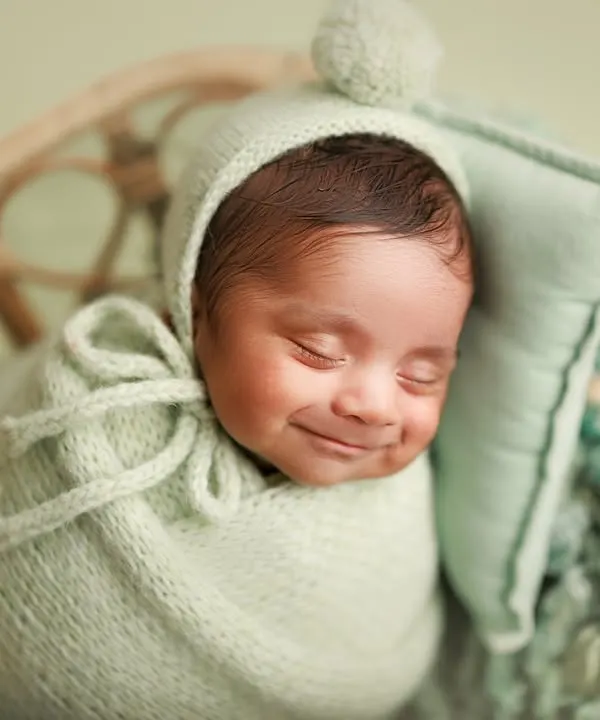 This is the magic I live for. Capturing a newborn's first smile is a moment of pure joy that families will cherish forever. It’s these sleepy, happy expressions that make every session so special to me.