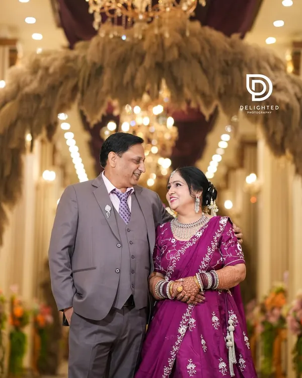 A beautiful portrait from a 25th wedding anniversary celebration. The loving glance they share after so many years together is a testament to their enduring bond.