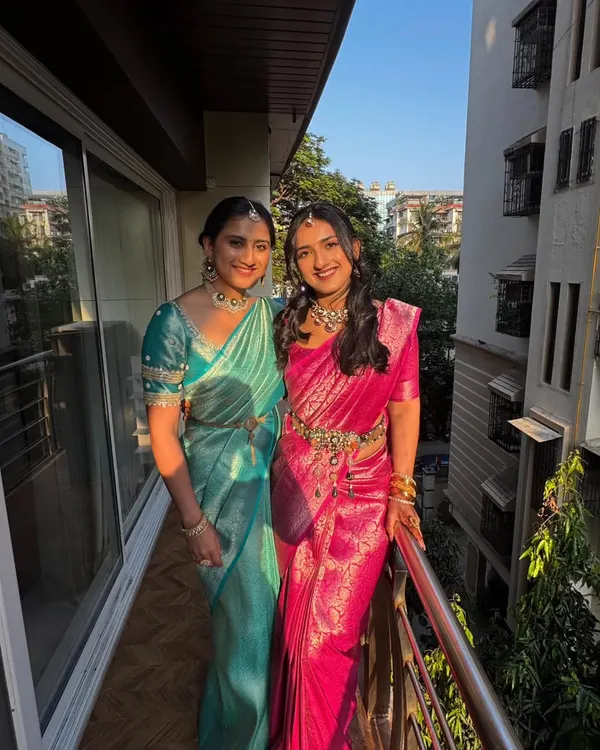 I had the pleasure of draping these two sisters for their cousin's wedding. They chose beautiful, vibrant silk sarees in teal and pink, and I created complementary drapes for a coordinated and elegant look.