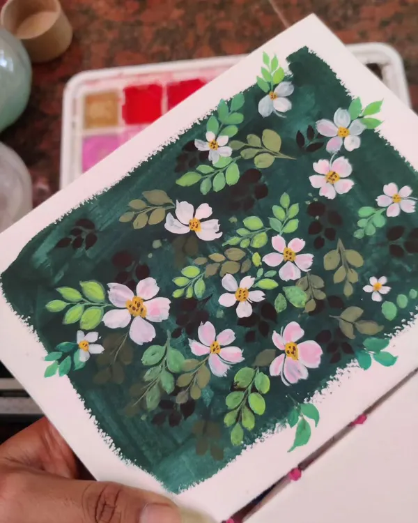 An example of my work with gouache, featuring delicate white flowers against a dark green background. The opacity of gouache allows for this beautiful contrast, making the flowers pop.