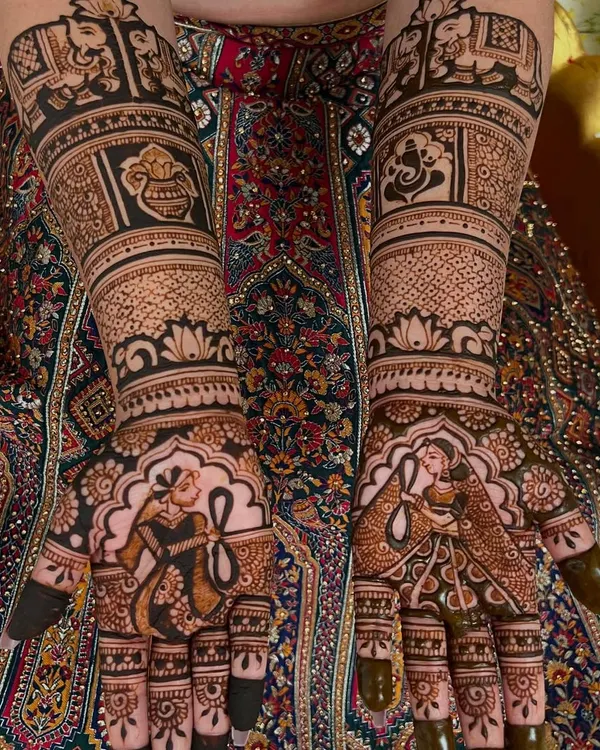 The classic Dulha-Dulhan (bride and groom) figures are a beautiful way to personalize your mehendi. I take care to draw them with expressive details to capture the wedding's essence.
