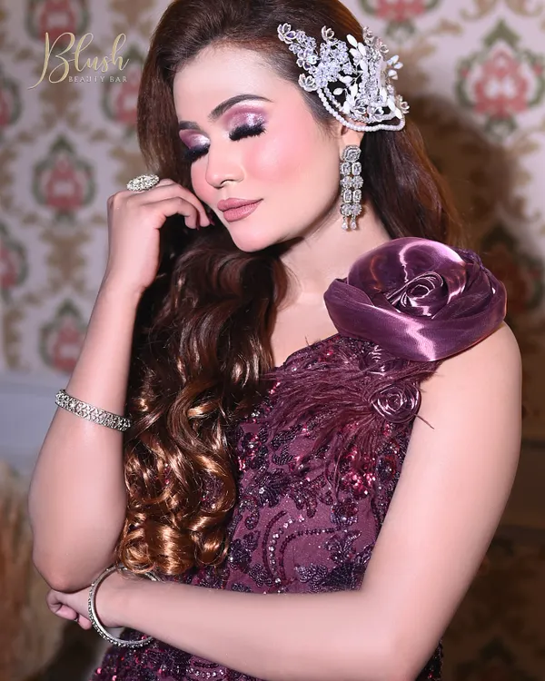 A beautiful purple-themed engagement or reception look. I teach how to use color in a sophisticated way, pairing a soft pink and purple eye with a matching lip and elegant hair accessory.