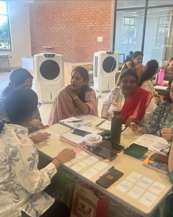 A moment of discovery during a professional development session with teachers. My goal is to create an environment where educators can experience the joy of hands-on learning themselves, so they can bring that same energy and understanding back to their students.