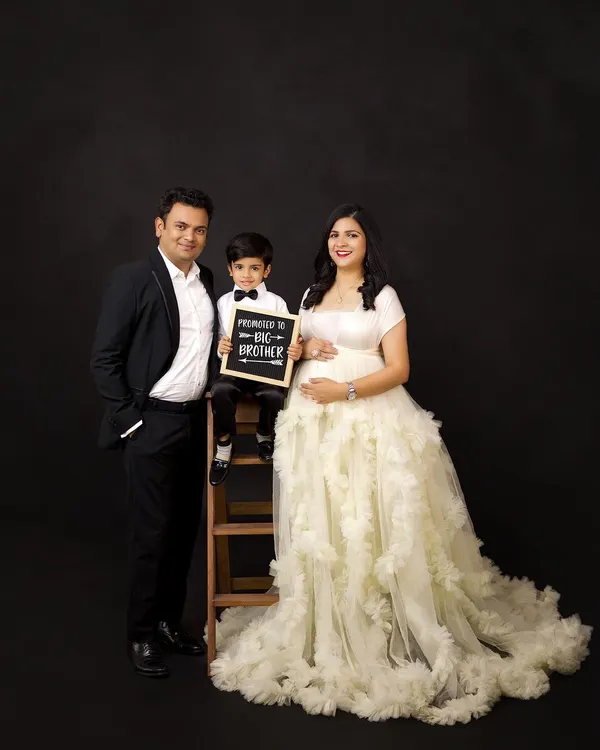 "Promoted to Big Brother!" We love including siblings in maternity shoots to celebrate the growing family. This family portrait is full of anticipation and joy.