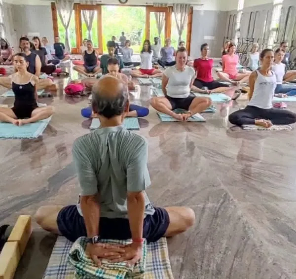 I am leading a focused group of students during an intensive workshop at our Ramanagara centre. This image captures the collective energy and deep concentration that we cultivate in our practice together.