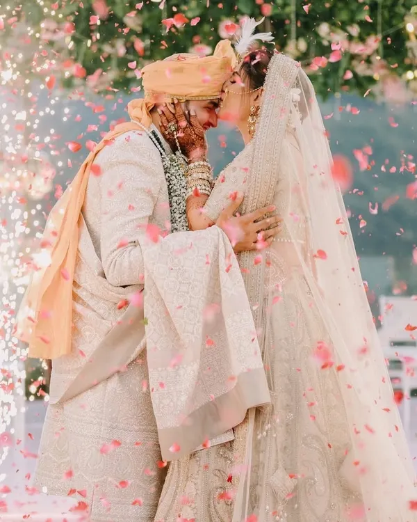 A quiet moment just for them, surrounded by a shower of petals and the glow of sparklers. We believe in creating these pockets of magic, where your love story is the only thing that matters.