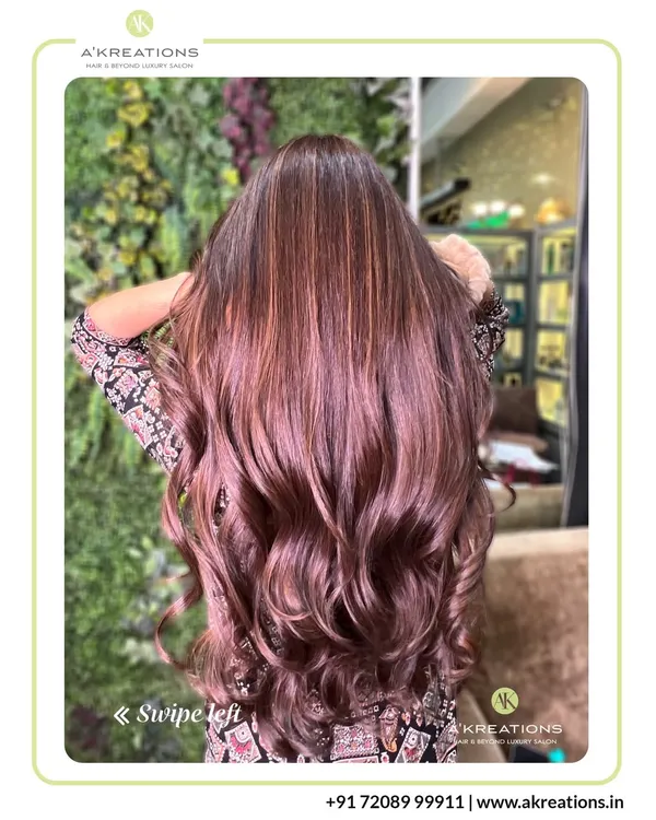 This is the art of transformation. We created these luminous, flowing waves of color using a custom-blended balayage technique to add dimension and a healthy, sun-kissed glow.