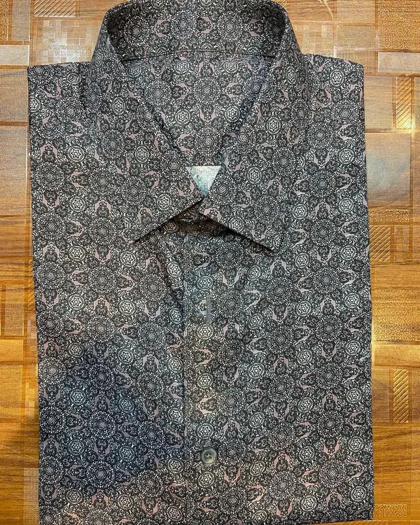 A custom-made formal shirt featuring a unique geometric print on 100% pure cotton fabric. I can help you find a print that expresses your personal style while maintaining a professional look.