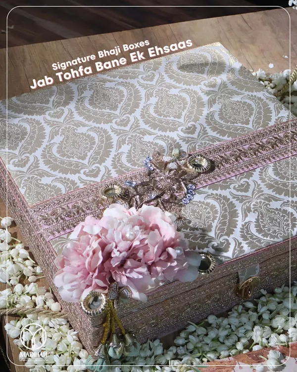 My signature Bhaji Box, where the gift becomes an 'ehsaas' or a feeling. The box itself is a work of art, with traditional paisley fabric and floral adornments, promising something truly special inside.