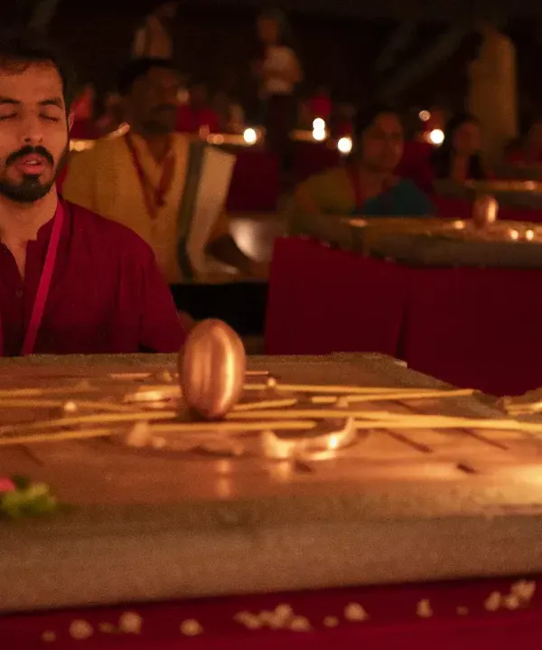 A moment of deep connection during the Yantra ceremony. With the Linga Bhairavi present, the space is filled with a vibrant, living energy that supports every seeker's journey.