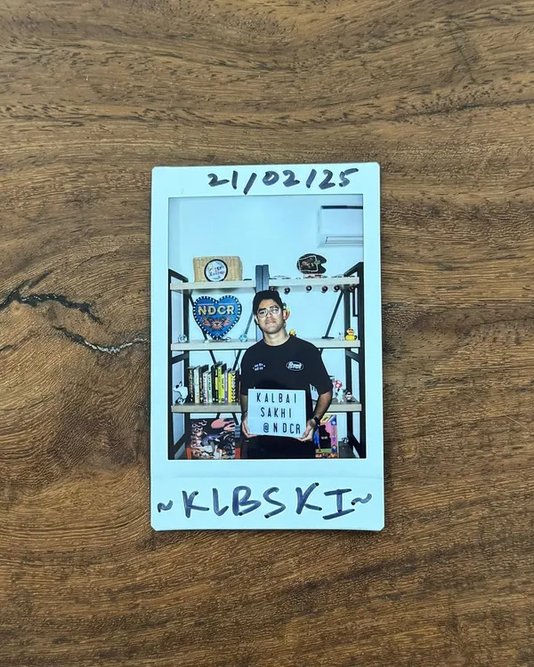 A polaroid from a studio session. Holding up a sign for my crew NDCR, this is a snapshot of the behind-the-scenes work that goes into building a community and brand.