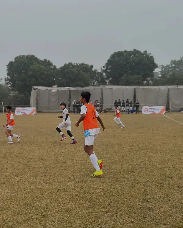 Our U-14 players in the midst of a competitive tournament match. The orange bibs show they are ready for action and working as a unit.