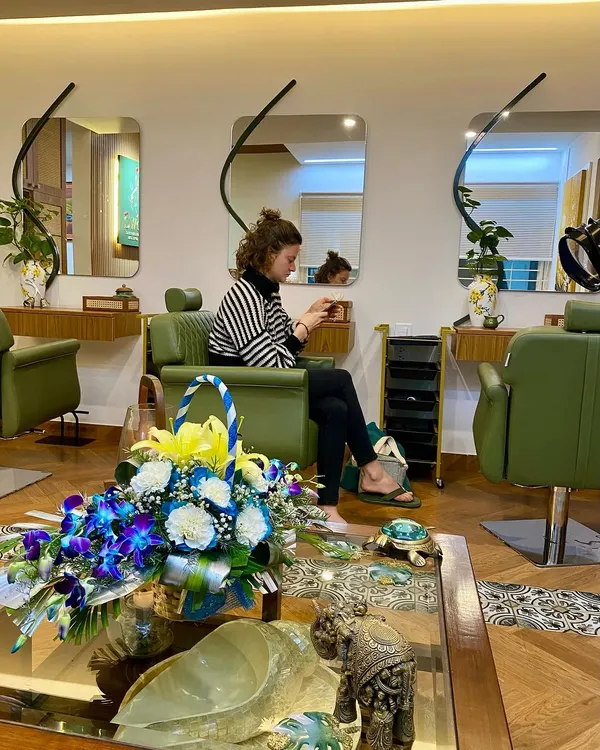 A quiet moment in the salon. I love seeing our clients, like Elsa from Paris, feeling completely at ease in the space we've created.