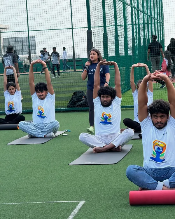 I believe that a change of scenery can transform a team's energy. Here, I am guiding employees at Withum through a morning yoga session on their office rooftop, helping them find focus and synchronicity before the workday begins.