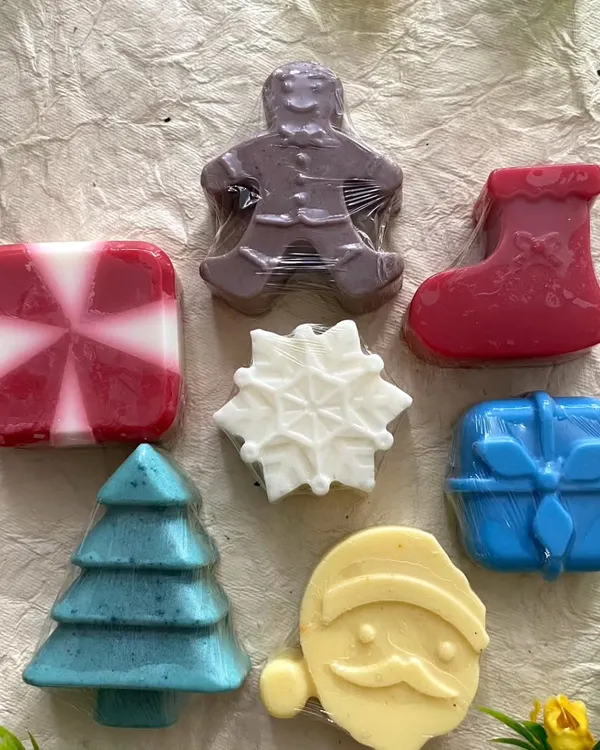My Christmas-themed soap set is so much fun to make. It includes a gingerbread man, stocking, snowflake, gift box, tree, and Santa, all made with my gentle camel milk formula.