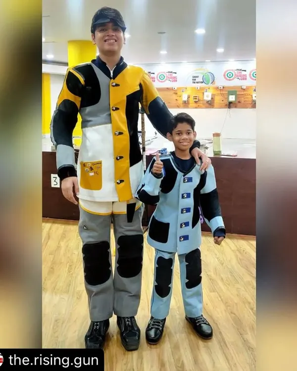 The journey to becoming a champion starts here. This picture of a seasoned competitive shooter with one of our aspiring young champions perfectly captures our mission to nurture future talent for the sport.