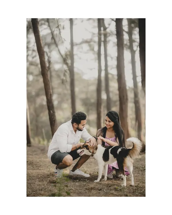 Including your furry friend in your pre-wedding shoot is a wonderful idea. It adds a personal and heartwarming touch to your story.