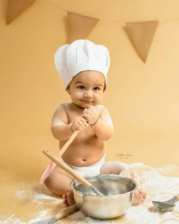 This little chef, with a mischievous smile and a wooden spoon, is the perfect example of the playful spirit I love to capture in my sitter sessions. It’s all about letting their budding personalities shine.