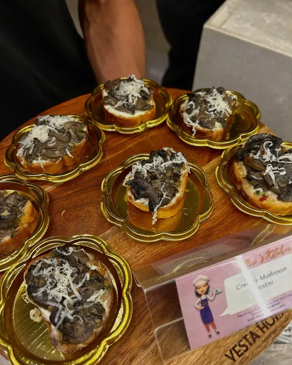 My Creamy Mushroom Crostini served on elegant, flower-shaped golden plates. Presentation is key, and I make sure every detail contributes to a high-end experience.