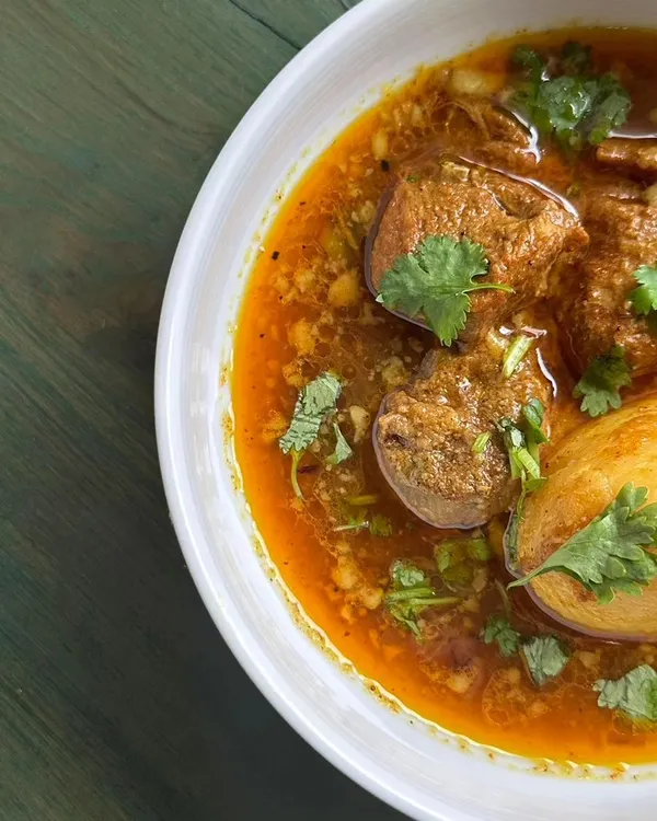 My slurpy mutton curry with chunky potatoes, a dish that was a big hit with my patrons. This is authentic Bengali comfort food, perfect for any family gathering or special event.
